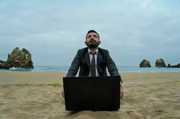 istock Businessman on the Beach - Work Follow 878686886