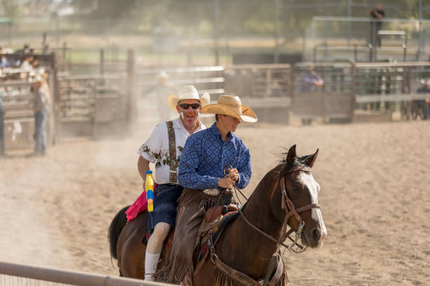 istock Rodeo Cowboys and Rodeo Clown 878692708
