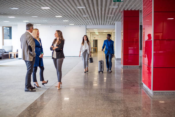 istock People in business center lobby 878699320