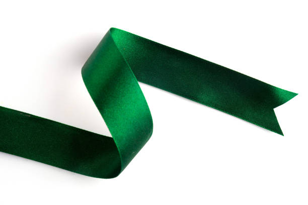 istock Green bow ribbon satin texture isolated on white background 878699740