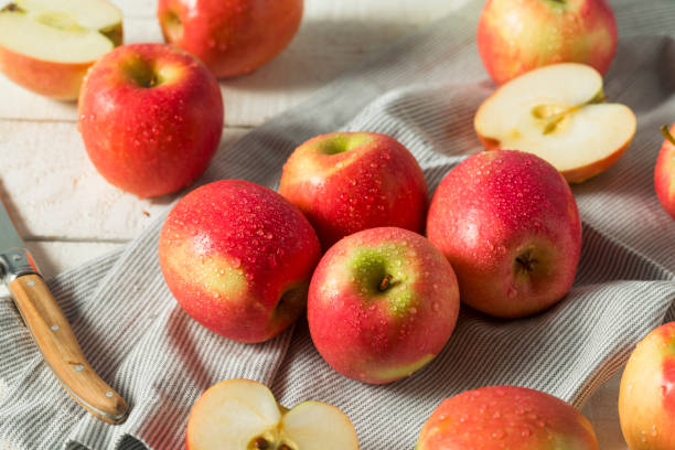 istock Raw Red Organic Pink Lady Apples 878702668