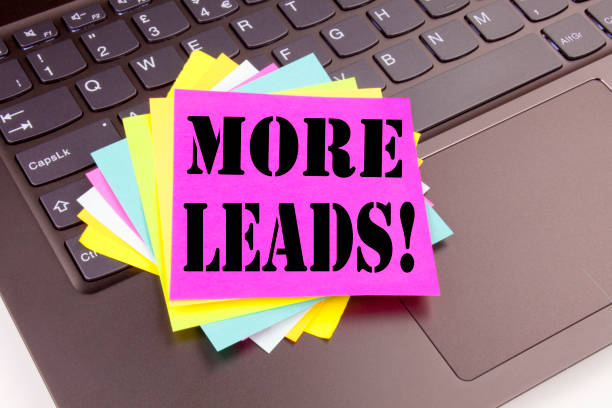 istock Writing More Leads text made in the office close-up on laptop computer keyboard. Business concept for Get More Leads Consumer Marketing Workshop on the black background with copy space 878702686