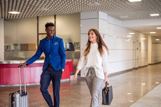 istock People in business center lobby 878702816