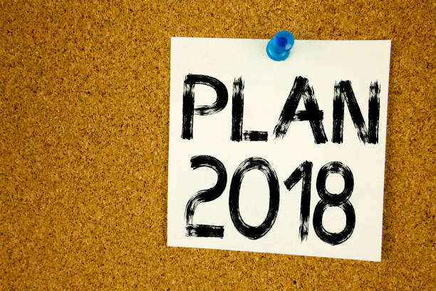 istock Conceptual hand writing text caption inspiration showing Plan 2018. Business concept for Strategy Action Plan 2018 written on sticky note, reminder cork background with copy space 878705514