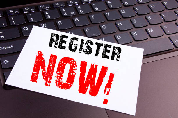 istock Writing Register Now text made in the office close-up on laptop computer keyboard. Business concept for Internet Registration Subscribe Workshop on the black background with copy space 878708752
