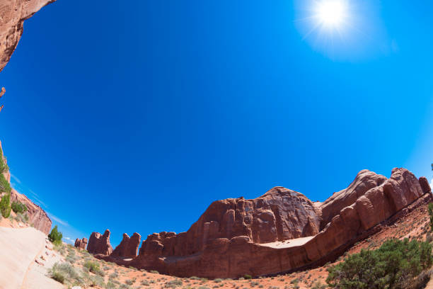 istock burning sun on sandstone mountain and desert landscape 878709322