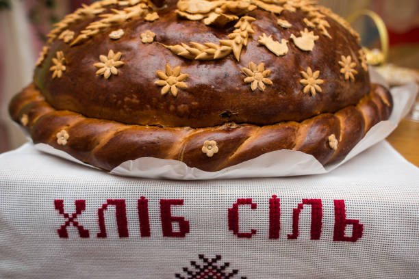 istock A wedding loaf beautifully decorated, on a Ukrainian towel 878716700