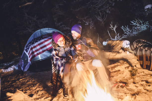 istock Couple warming up bodies next to the fireplace 878717102
