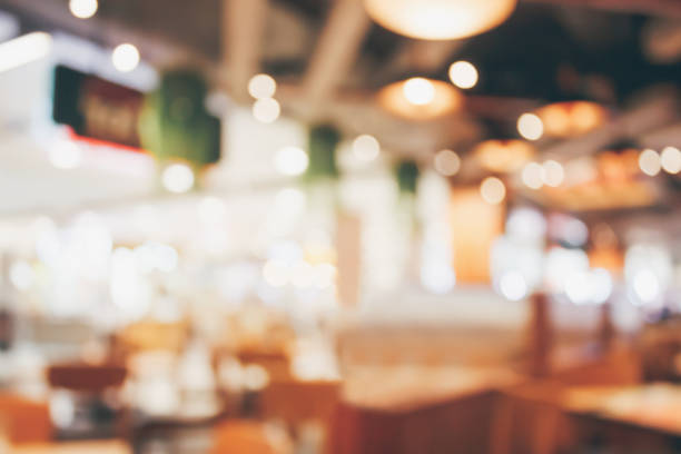 istock Restaurant cafe or coffee shop interior with people abstract blur background 878717118