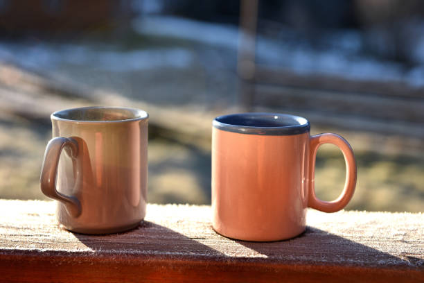 istock Morning coffee cups on a balcony 878717392
