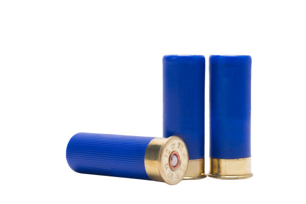 istock three blue cartridges from a gun, over white background 878717472