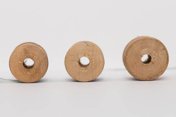 istock Bobbins of thread isolated on white background 878721866