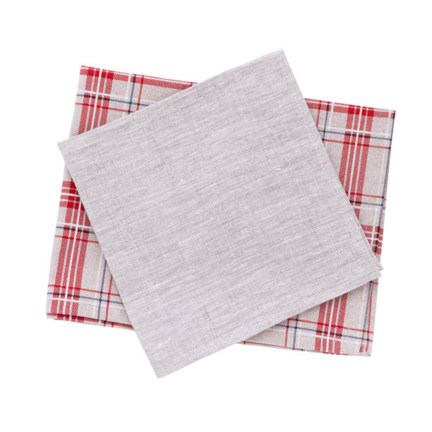 istock Napkins isolated on white. Multi-colored linen napkins for restaurant. Empty napkins mock up for design. Napkins top view close up. Place for text on napkin. 878730592