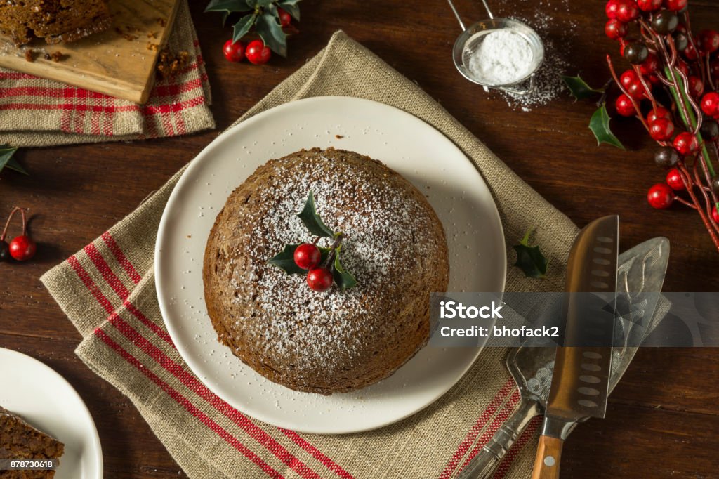 Sweet Homemade Christmas Figgy Pudding Sweet Homemade Christmas Figgy Pudding with Powdered Sugar Christmas Pudding Stock Photo