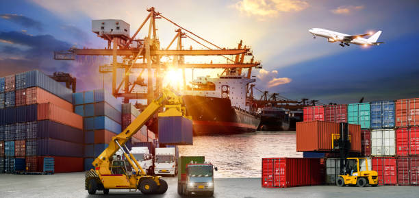 istock Logistics and transportation of Container Cargo ship and Cargo plane with working crane bridge in shipyard at sunrise, logistic import export and transport industry background 878730642
