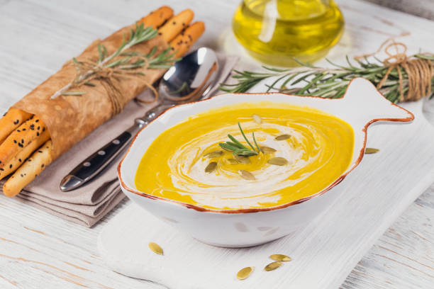 istock Pumpkin soup with cream and pumpkin seeds 878731014