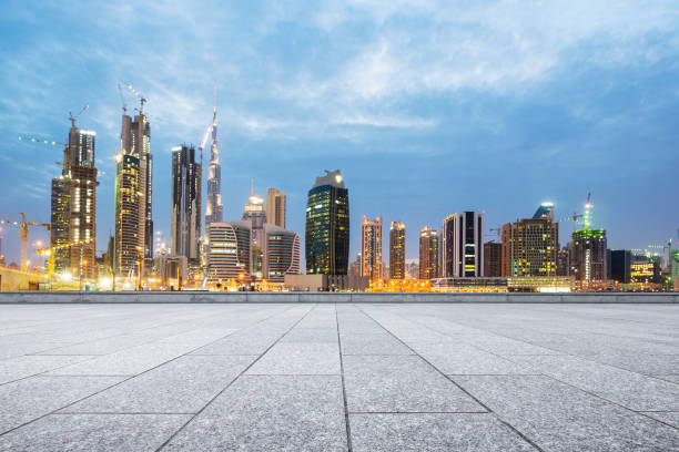 istock empty marble floor with modern buildings at twilight 878731870