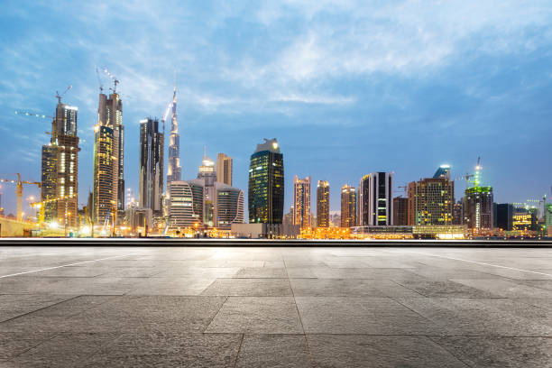 istock empty marble floor with modern buildings at twilight 878734124