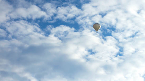 istock Hot Air Balloon and Cloudy Sky 878739688
