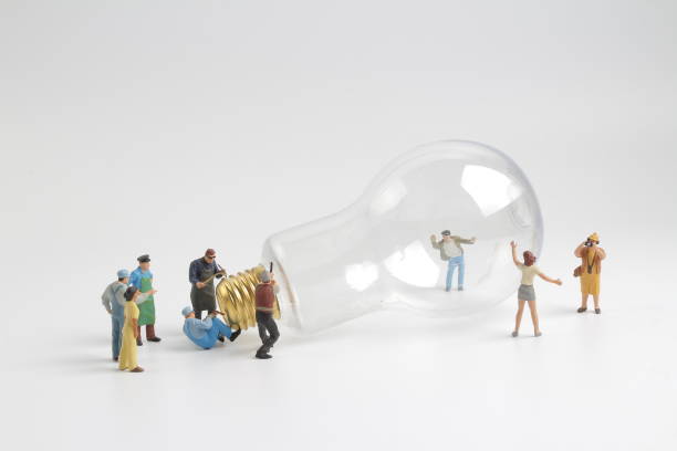 istock group of figure working on a  bulb 878742158