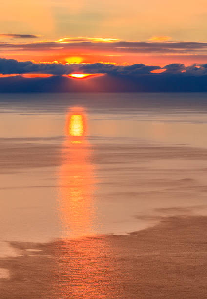 istock The sun comes out from behind the clouds at dawn 878751208