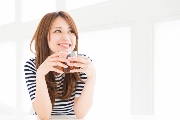 istock woman who drink tea 878753920