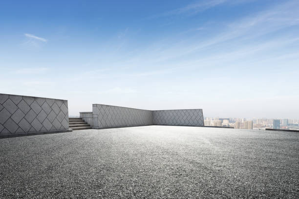istock empty asphalt road with modern cityscape in foggy day 878764080