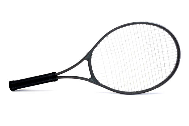Seasoned black graphite tennis racket isolated on white background.