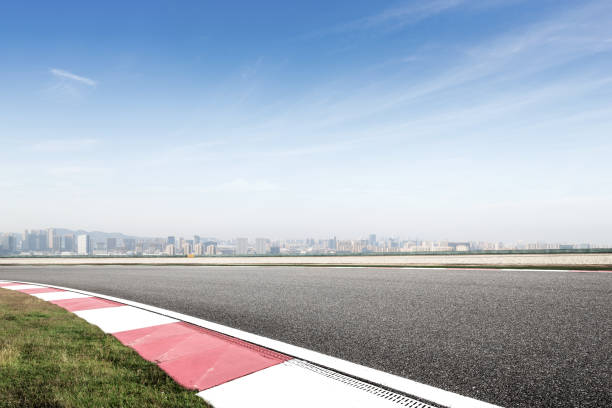 istock empty asphalt road with modern cityscape in foggy day 878765534