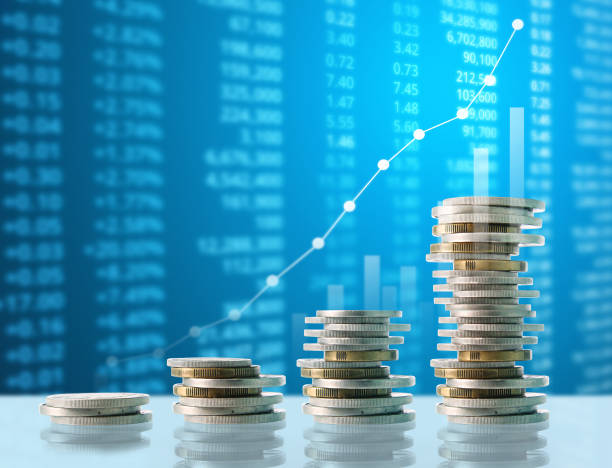 istock Coins graph stock market 878781348