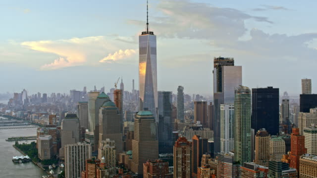 Aerial shot of the Lower Manhattan and the Freedom Tower reflecting the clouds. Shot in USA.