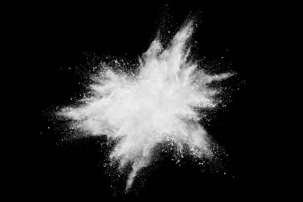 istock Freeze motion of white powder explosions isolated on black background 878797938