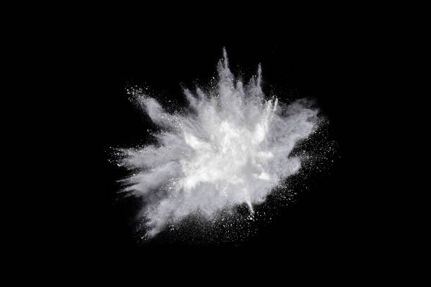 istock Freeze motion of white powder explosions isolated on black background 878801016