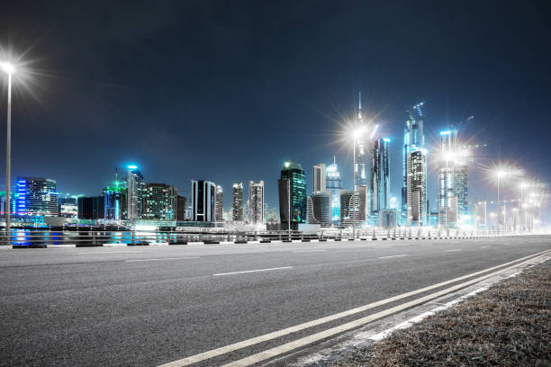 istock empty asphalt road with modern buildings at night 878801078