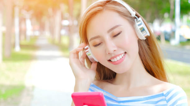 istock woman listen music 878803506