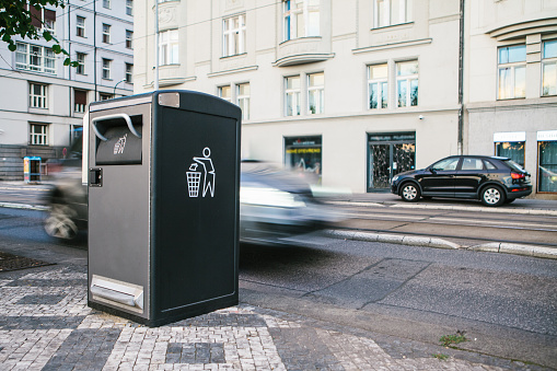 A modern clever trash can on the street in Prague in the Czech Republic. Collection of waste in Europe for subsequent disposal. Eco-friendly waste collection