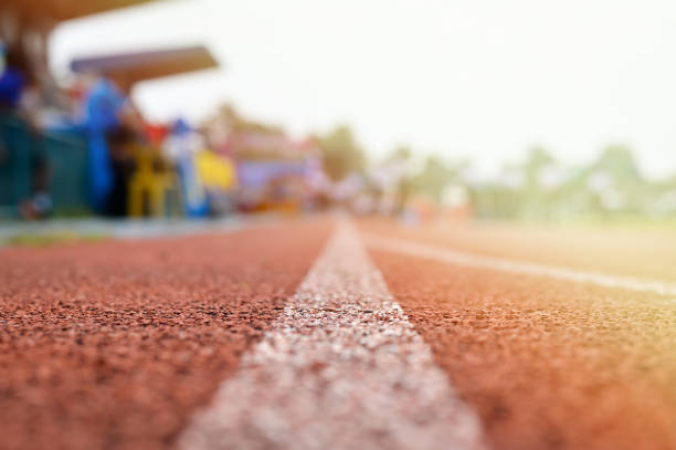 istock Running track or Racetrack with blurred Background selective focus vintage style for product or business background. 878819756