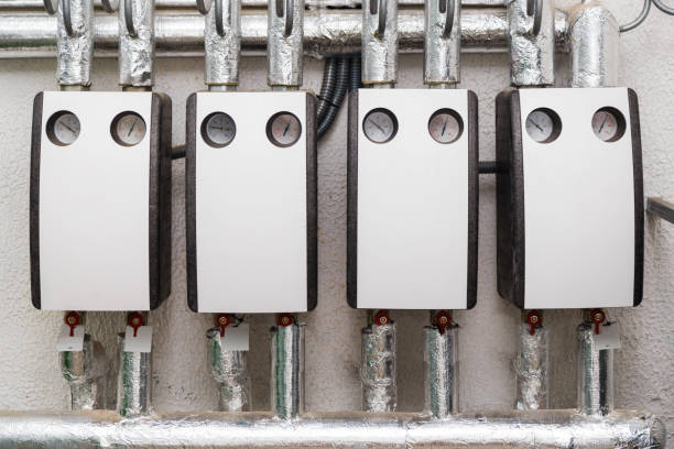 istock Group of hot water circulating pumps installed in boiler room 878820250