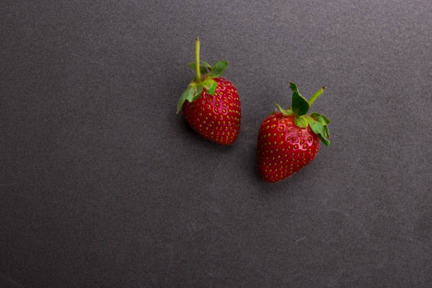 istock Strawberry on metal background. Top view 878822514