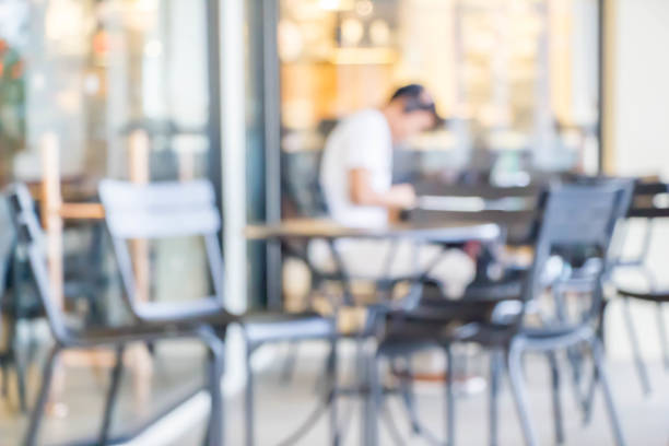 istock blurred people in coffee shop 878830040