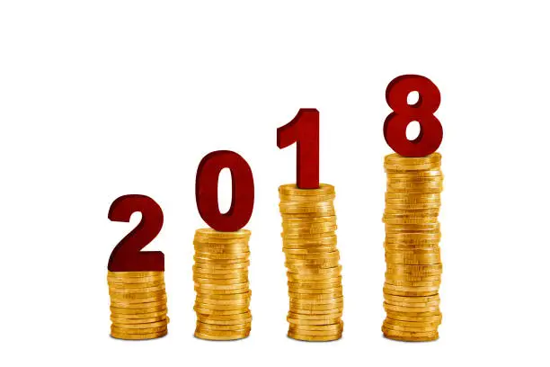 Image of numbers 2018 above pile of gold coins shaped growth chart, isolated on white background