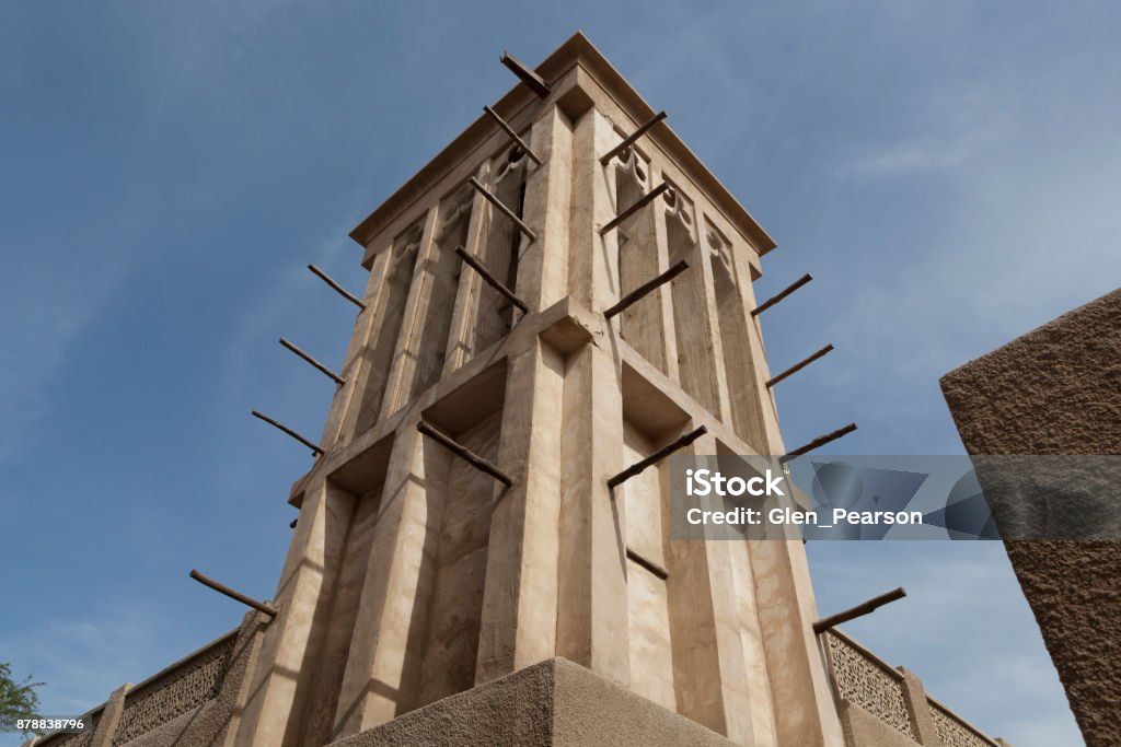 A traditional windtower in the Al Fahidi Historical Neighbourhood, Dubai A traditional windtower or barjeel in the Al Fahidi Historical Neighbourhood, also known as Al Bastakiya, in Dubai, United Arab Emirates. The windtower is a traditional way of cooling buildings in the Gulf region Al Bastakiya Stock Photo