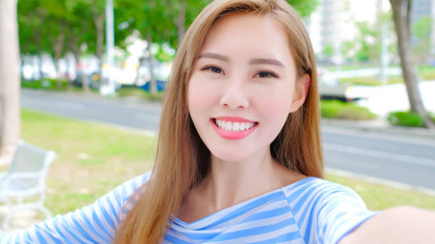 istock woman selfie happily 878849248