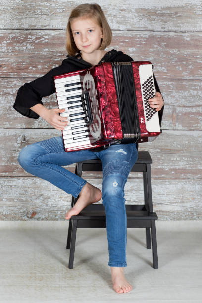 istock Young accordionist playing an accordion 878849304