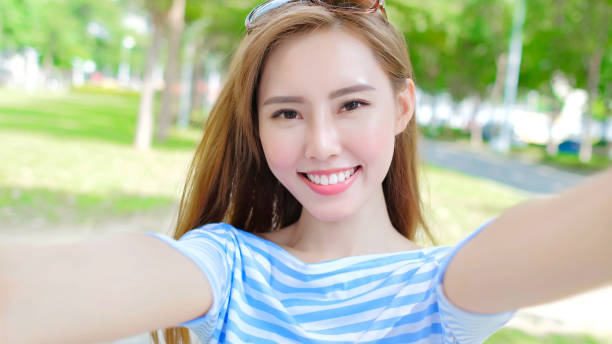istock woman selfie happily 878849506