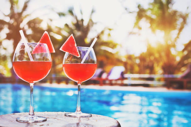 istock two glasses of exotic cocktail, beach vacation 878852250