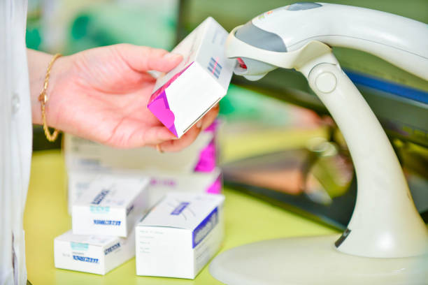 istock Pharmacist scanning barcode of medicine drug 878854960