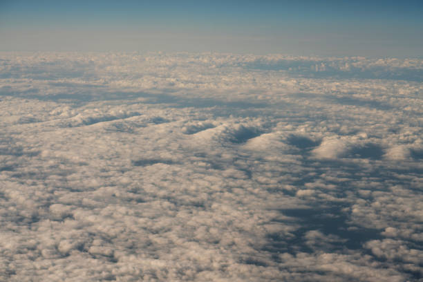 istock cloud in the sky, Looking to the window in the airplane. 878859038
