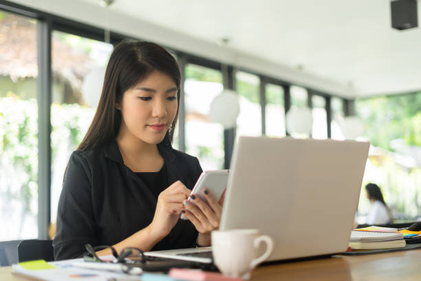 istock modern business woman working with smartphone in office 878859740