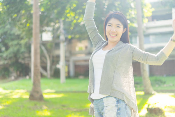 istock happy girl look at camera laughing and smiling 878859746